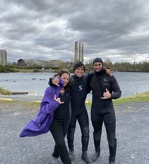 Scuba instructor giving thumbs up with students